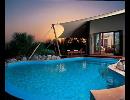 Отель Al Maha Desert Resort & Spa 5*. Бассейн у бунгало